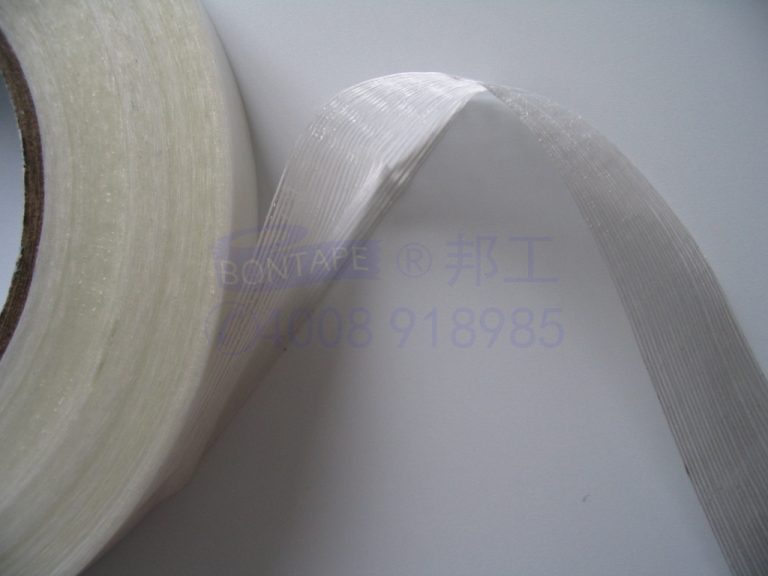 transformer tape with filament reinforced, amorphous core bundling tape